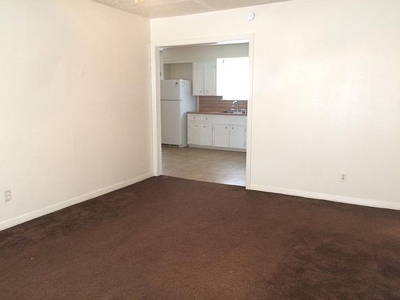 Living room leading into kitchen.