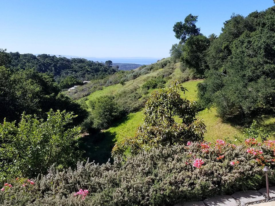 Patio view: ocean, islands, and mountains.