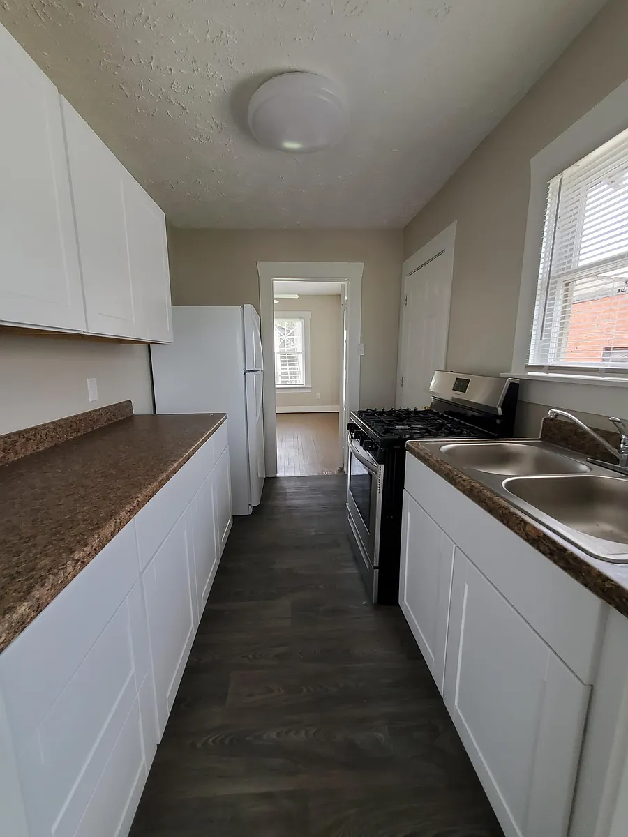 Kitchen with new cabinets and appliances - 804 Louise St