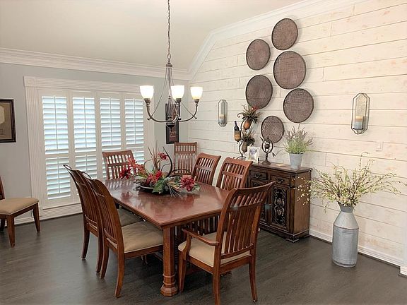 A cozy dining room with Plantation shutters is sure to be a place to sit and enjoy a great meal with family & friends!