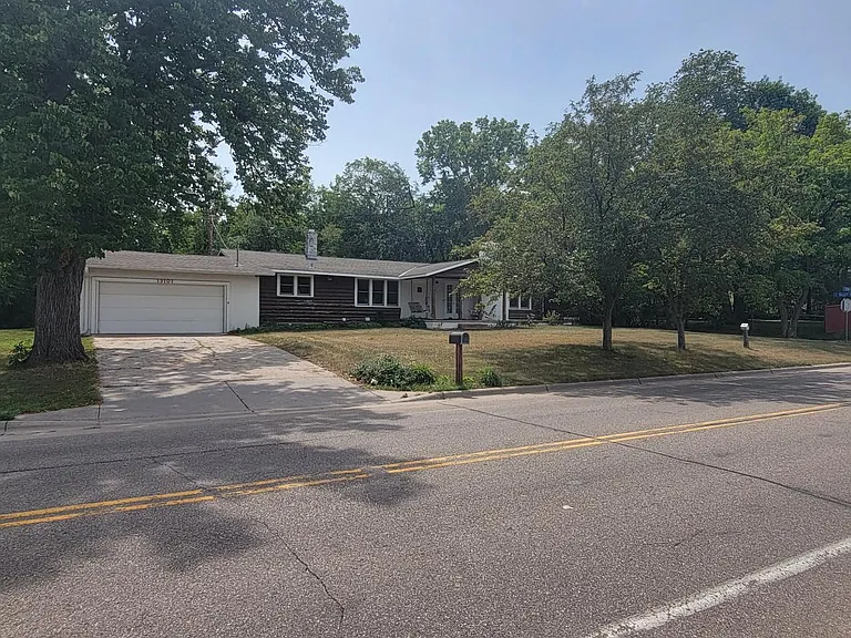 Delton avenue is the frontage road that runs in front of this home. The high school is just a short walk down this road to the left. To the right is the newly opened Red Savoy Pizza (just around that hedge).
