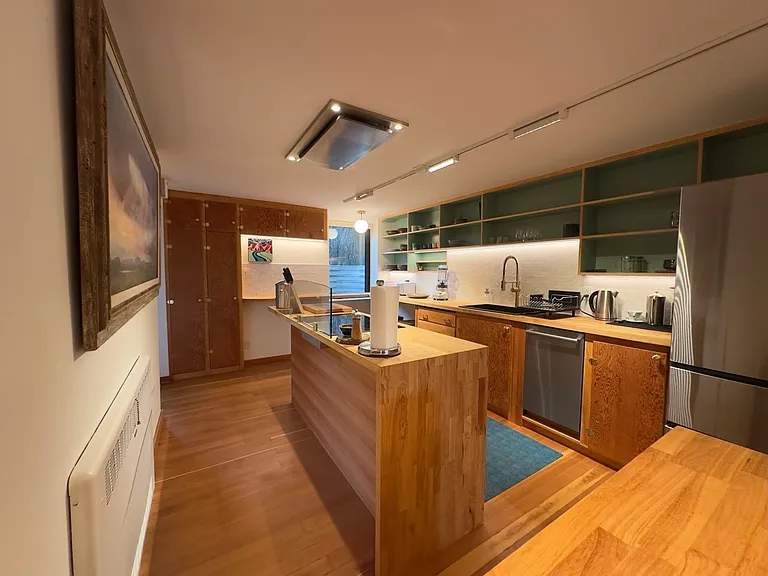 Chef's kitchen designed for cooking and gathering, stocked with all the essentials for comfort and style.