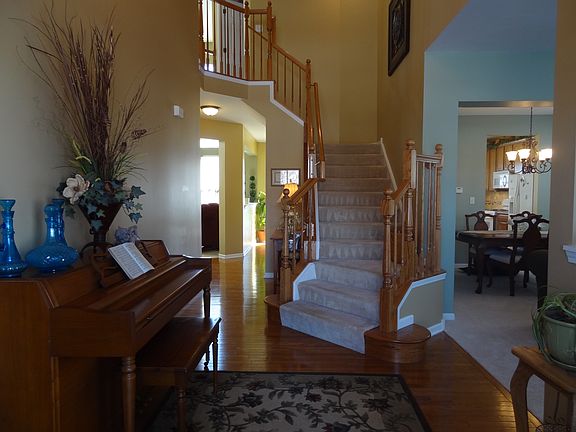 Grand entry into the two story foyer with a beautiful winding staircase.