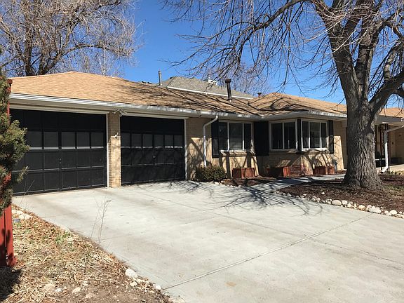 Oversized two car garage with newer concrete driveway