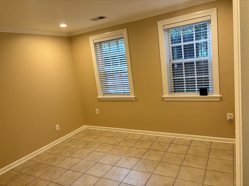 Window view of the front room right off of hte entry way