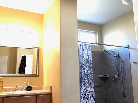 6' walk-in shower with tile seat and skylight