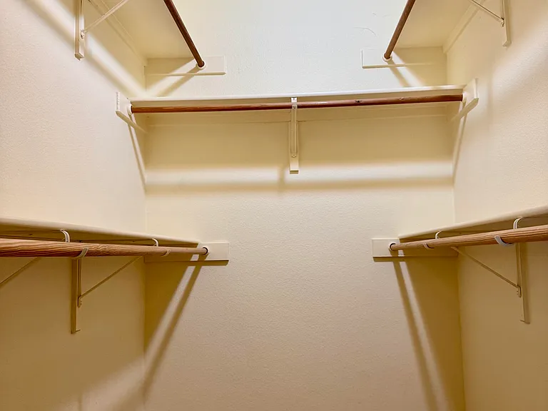 LARGE walk in Master closet w/ upper and lower shelves