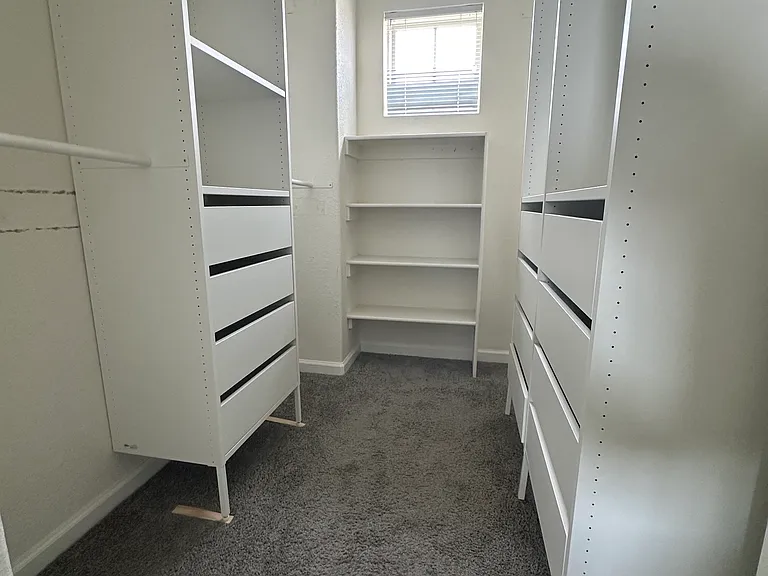 Primary Walk-In Closet with Built In Storage