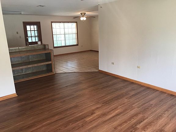 Hardwood and tile throughout.