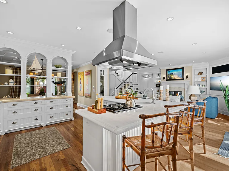 Kitchen with natural stone counters. recessed lighting and professional appliances