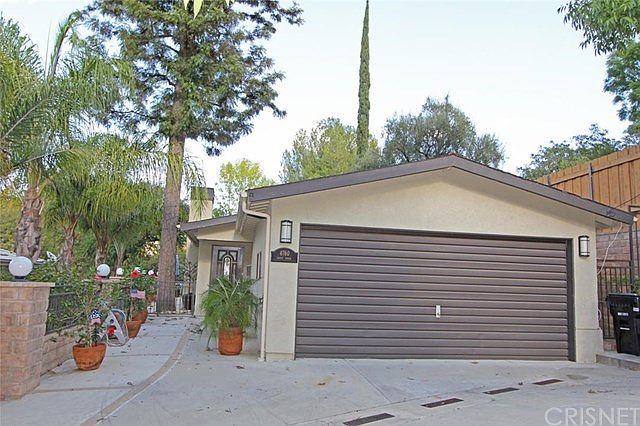 Detached guest house with attached garage.