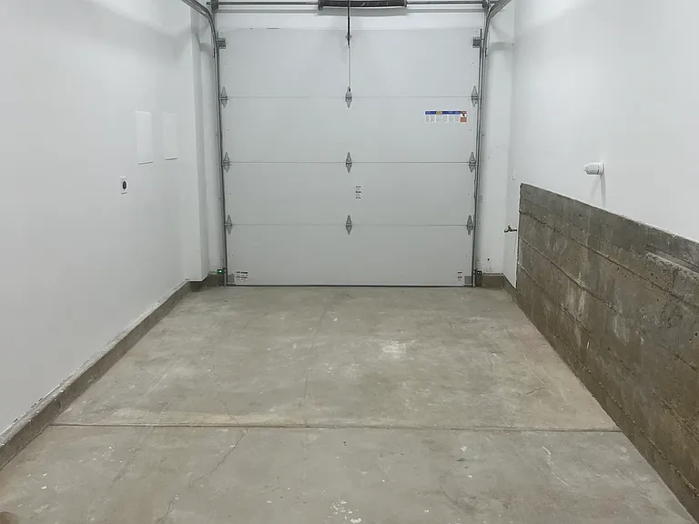 One car garage with EV wiring.