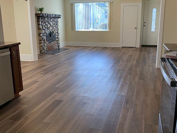 Open living space between living room, dining room and kitchen.