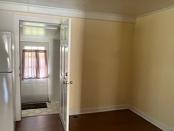 Dining area door leads to laundry and second bathroom.