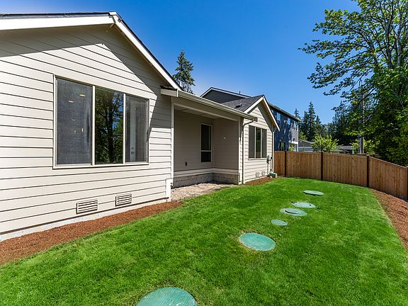 Yard is fenced and landscaped for summer fun