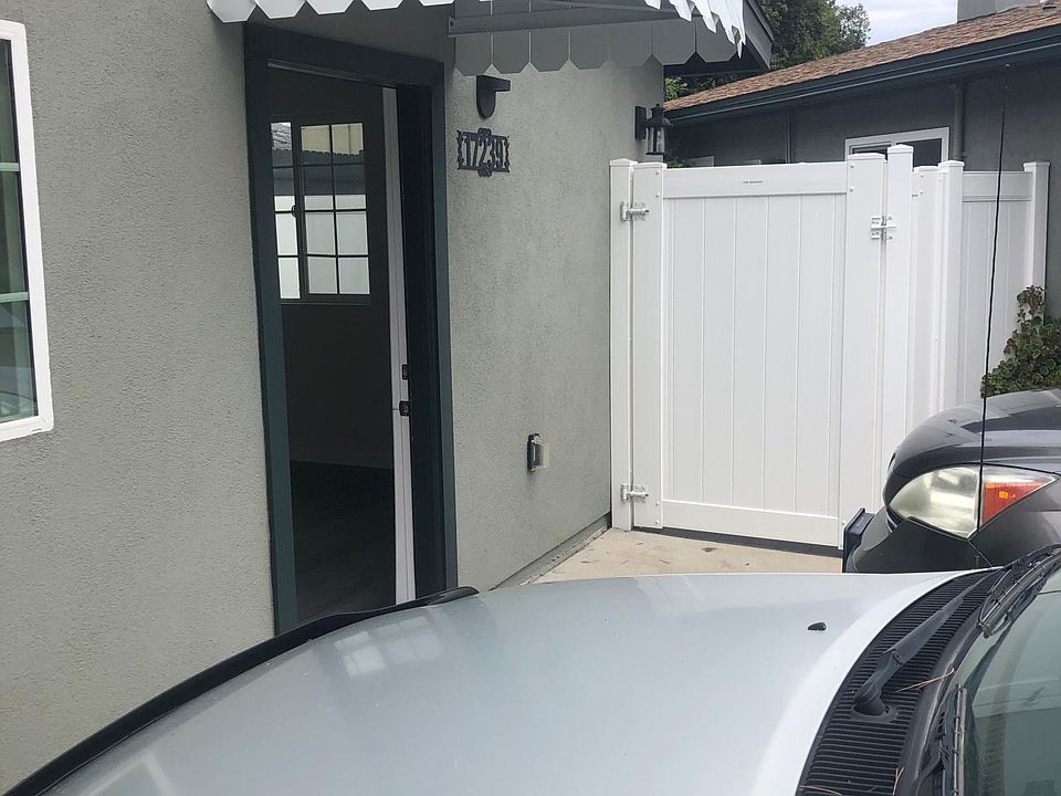 Main entry door, and side gate to private patio.