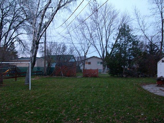 View of double lot yard from kitchen
