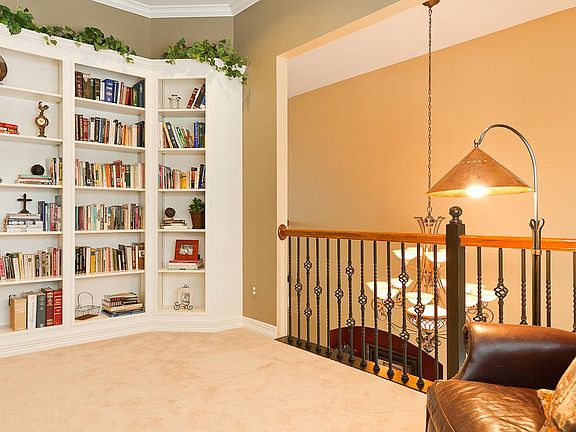The study has built-in book shelves and crown moulding.