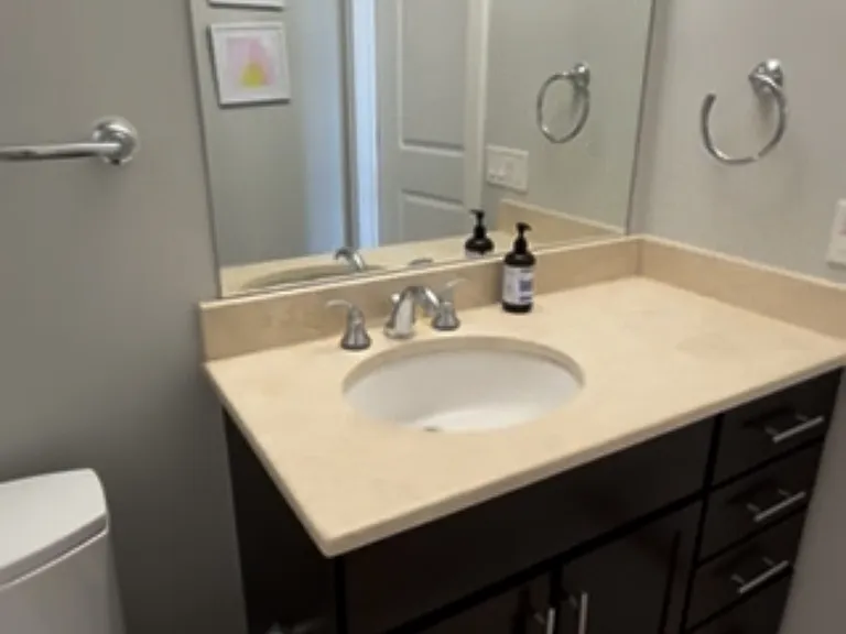Secondary bath. Features tub and shower.