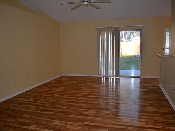Living room with access to the backyard through a glass sliding door.