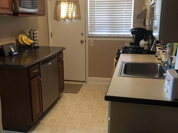 Kitchen with door leading to back patio