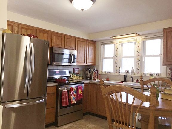 The kitchen is nicely updated featuring a large stainless steel refrigerator and stainless range, microwave and dishwasher to compliment it.