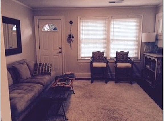 spacious living room with non working fireplace