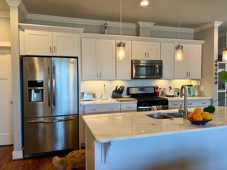 House is just 10 years old so lots of cabinet space, marble counter tops, stainless steel appliances, a large pantry. Room for bar stools if you desire. *NOTE: house comes unfurnished (pics show current owner's furnishings that will be moved).*
