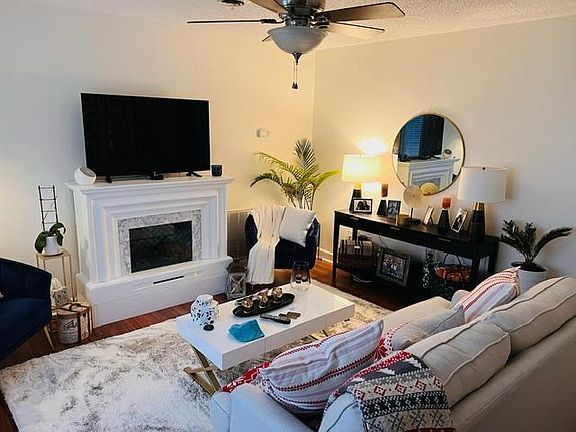 Living room, large windows on the left side of the room not in the photo