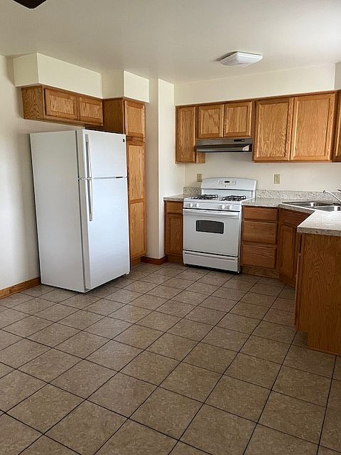 Kitchen with ample cabinet space and tiled floors