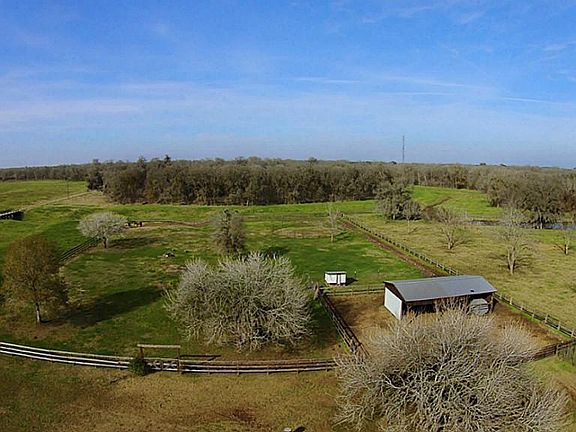 This provides a look at the back of the property that includes the barn, corral and pastures. It also provides a glimpse of Bessie's Creek that borders the property in the back.