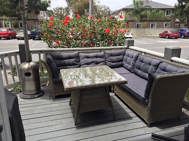 Patio with BBQ and seating area.