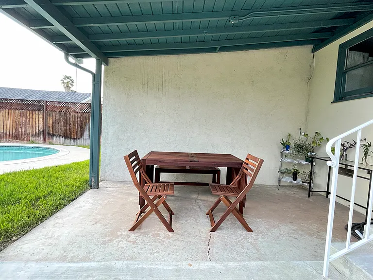 Covered patio area (house has been painted white, all green areas are now a cool gray)