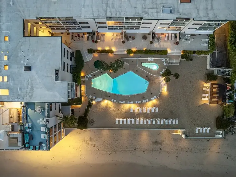 Embrace the ease of beachfront living with direct access, where sandy shores meet your doorstep.