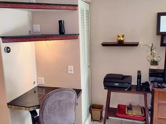 Designated desk area with storage and ink-jet printer (ink not included)