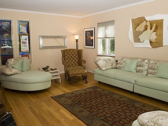 Large living room with woodburning fireplace.