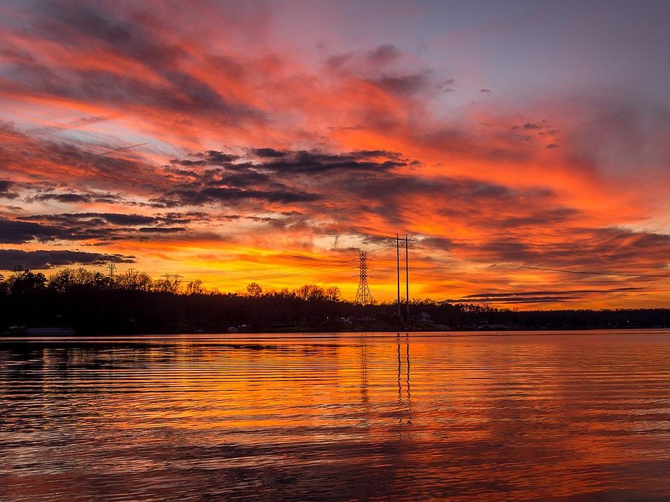 Beautiful Sunsets! This is the scene one sees from patio, deck, and all rooms in the home.