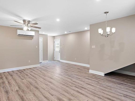 View of living room and entrance door.
