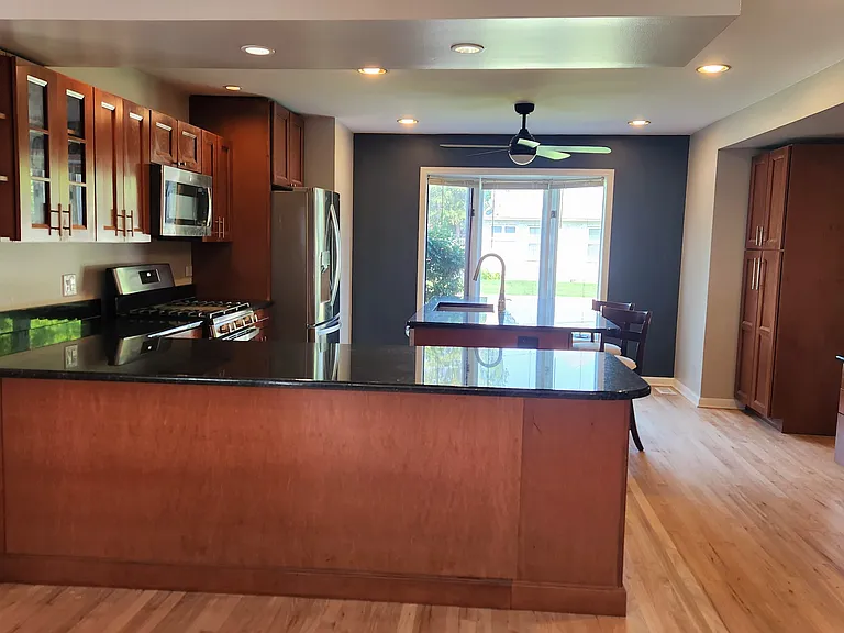 Kitchen with view of breakfast bar