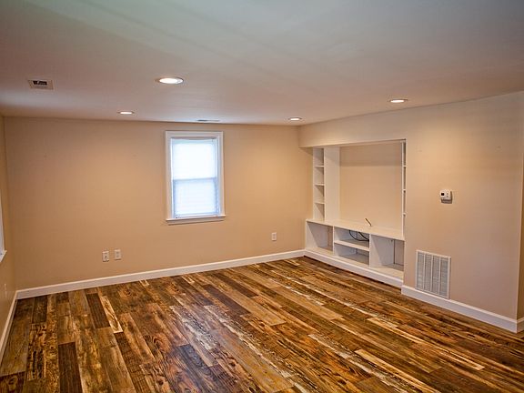 Newly Remodeled Living Room with Built-in Shelving for Cable TV