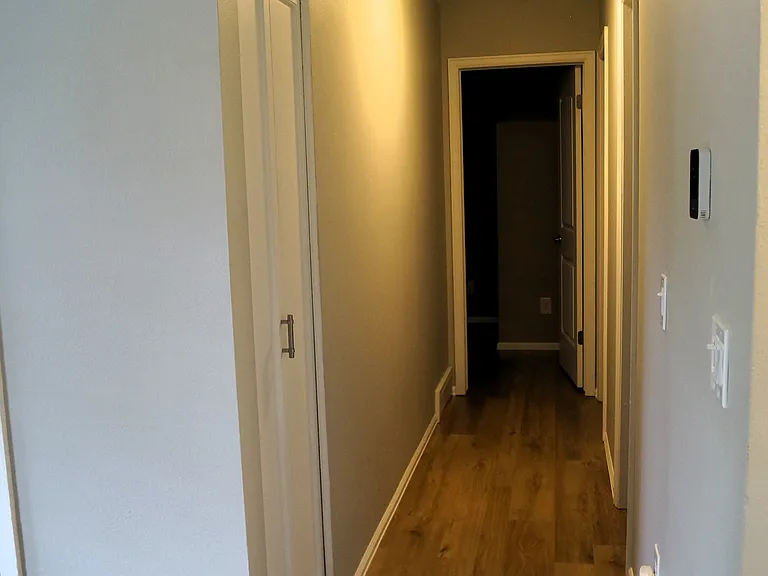 View from Livingroom: hallway to bedrooms and main bathroom.
