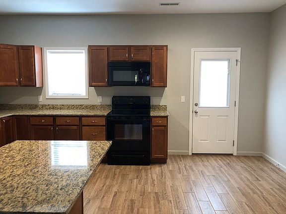 Spacious kitchen with dine in area.