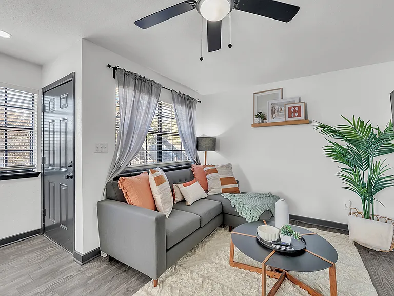 Experience comfort in this chic living room, blending modern elegance with cozy accents.