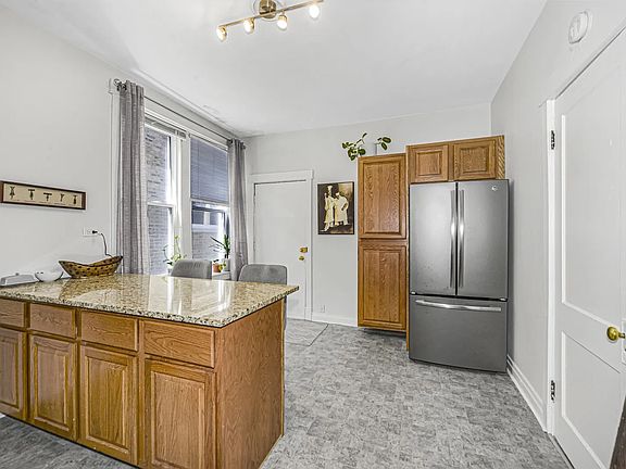 kitchen with new GE appliances and quartz countertops