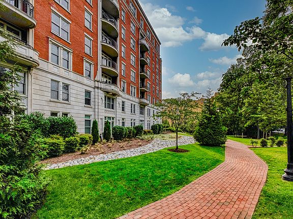 Lush greenery and walkways throughout the community