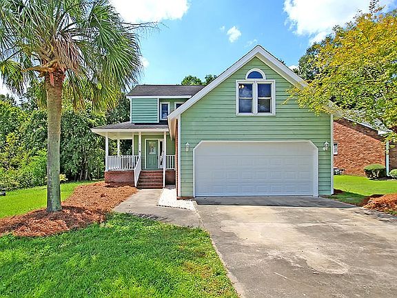 Wraparound porch with swing