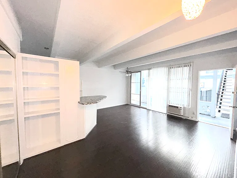 Enjoy plenty of natural light and windows and built in bookshelves.