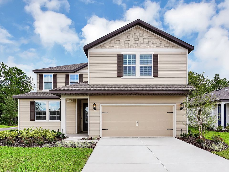 The Wayside by LGI Homes with beautiful front yard landscaping