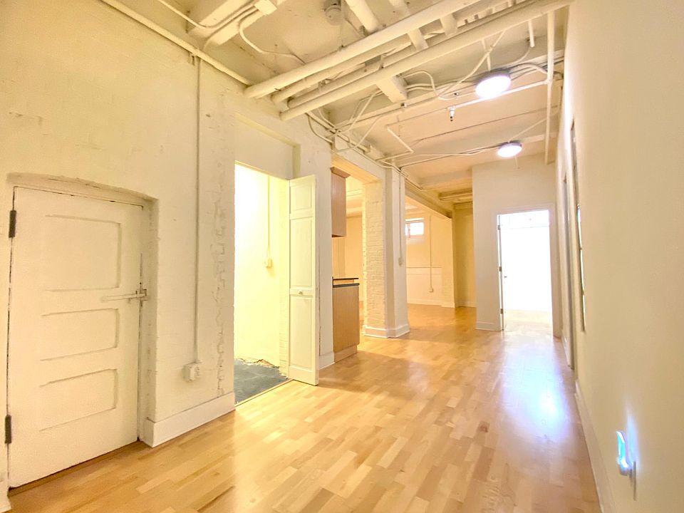 Hallway into the main living space and bedrooms.