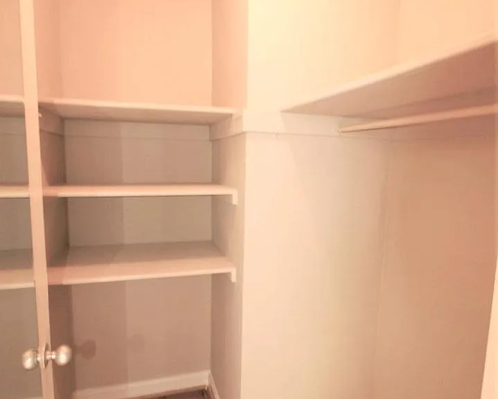 Large Walk In Closet across from Bathroom